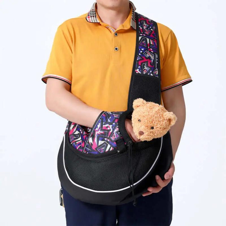 Carrying Pets Bag Outdoor Cross body Bag for Dogs and Cats, man holding bag with soft toy inside.